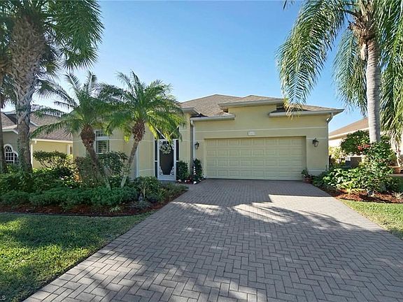 Front view of the home with it's lush gardens.