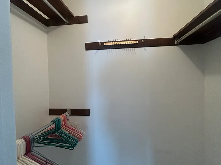 The master offers two closets side by side like this for a his & hers closet style