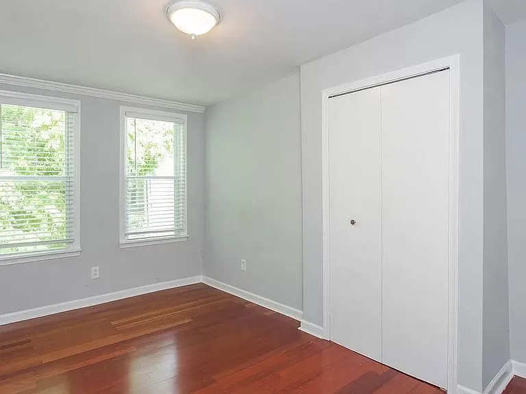 Unfurnished Back Bedroom with previous light fixture. Currently there is a ceiling fan with light