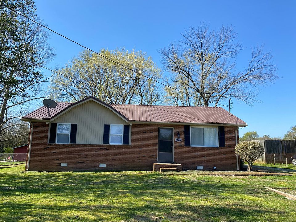 Wonderful brick ranch with a new metal roof on 1/2 acre!