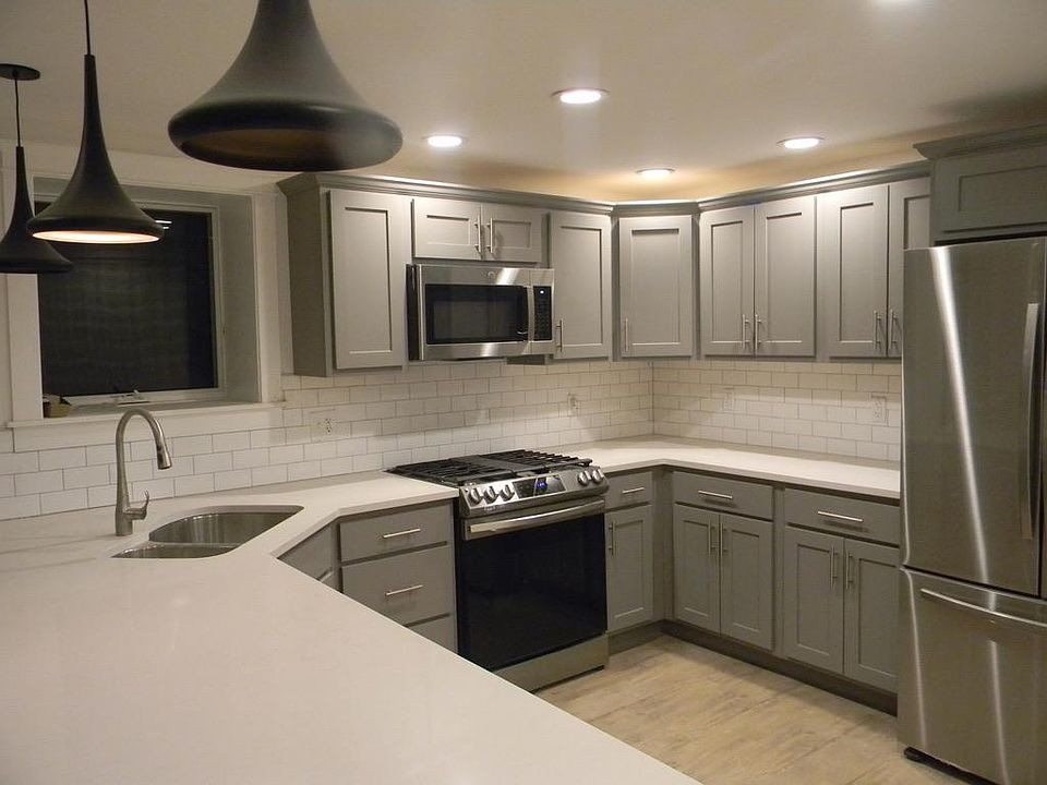 Kitchen with all new appliances including dishwasher, gas range, microwave and exhaust vent, french door refrigerator with ice maker, disposal.