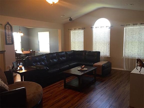 Large family room with vaulted ceilings.  Wired for surround sound.