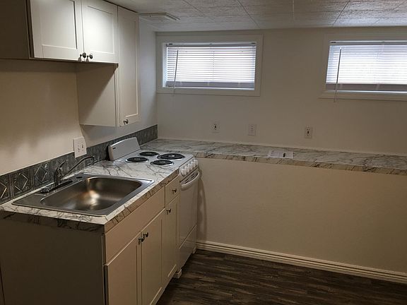 New cabinets, sink, oven, countertops, flooring, windows, lighting. Lots of counter space...