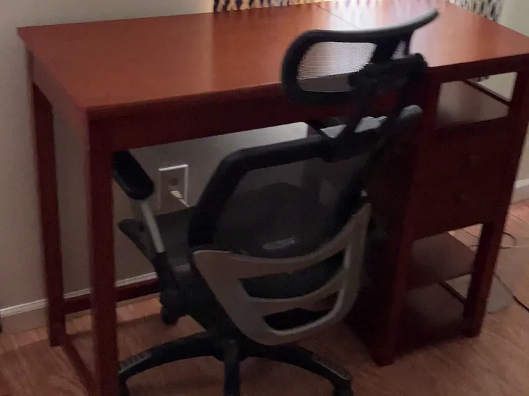 Bedroom 2 includes a desk and desk chair