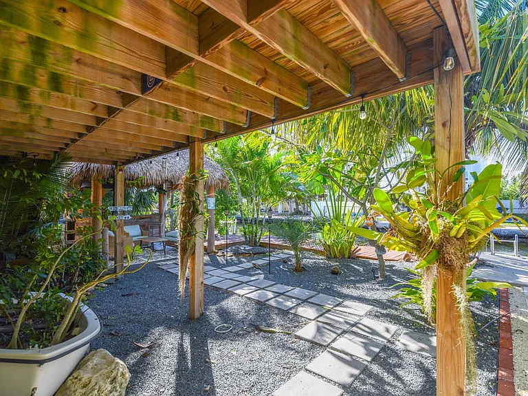 Outdoor space with tiki bar and outdoor seating