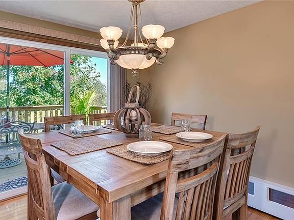 Sliding glass doors transitions the dining room to the outdoor deck.