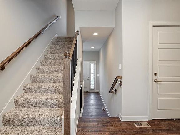 Front entry hallway to Kitchen and Dining Room.  Stairs to the 2nd Level.