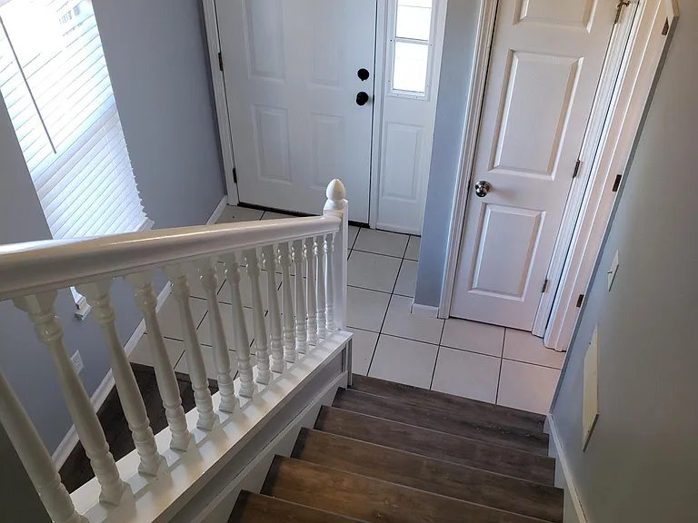 View of front door from staircase