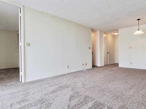 Living and dining room with high ceilings