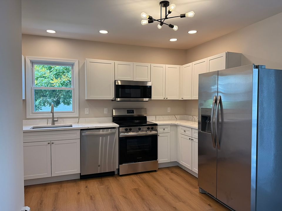KITCHEN - all brand new appliances, fixtures, finishes, windows. Sizable kitchen lots of cabinet/storage space, brand new cabinets, quartz countertops, and wonderful lighting.