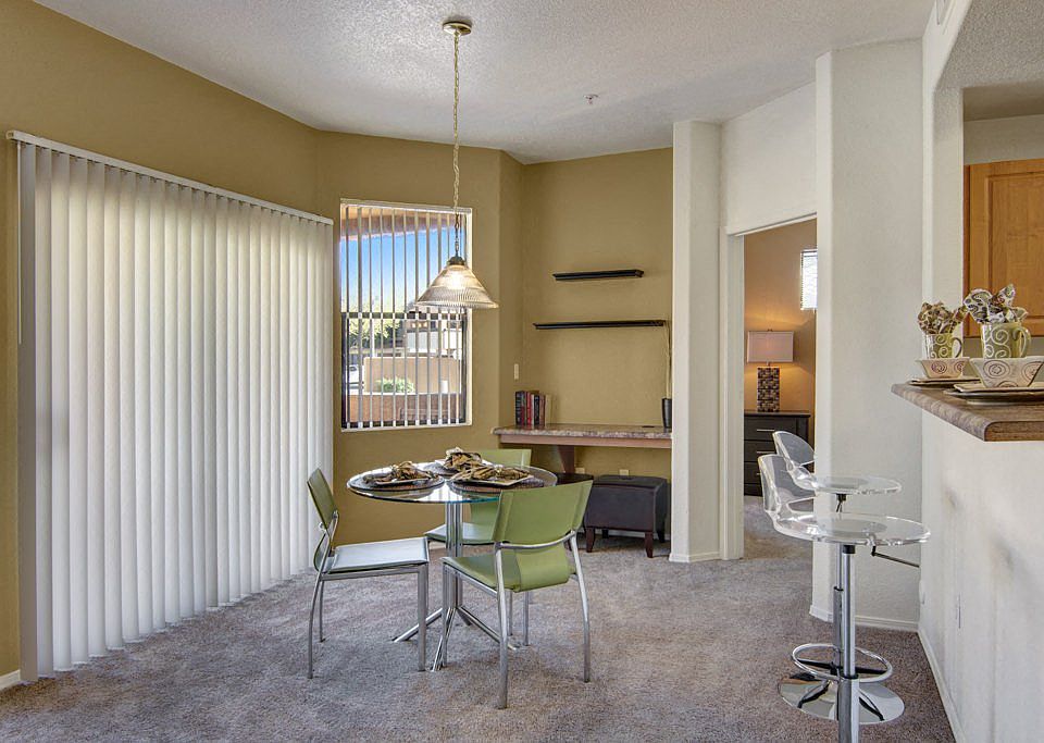 Arezzo Apartments- furnished dining room with balcony
