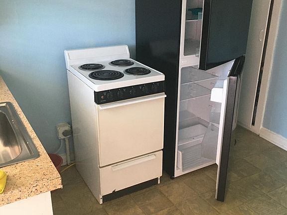 Kitchen, immediately inside front door.