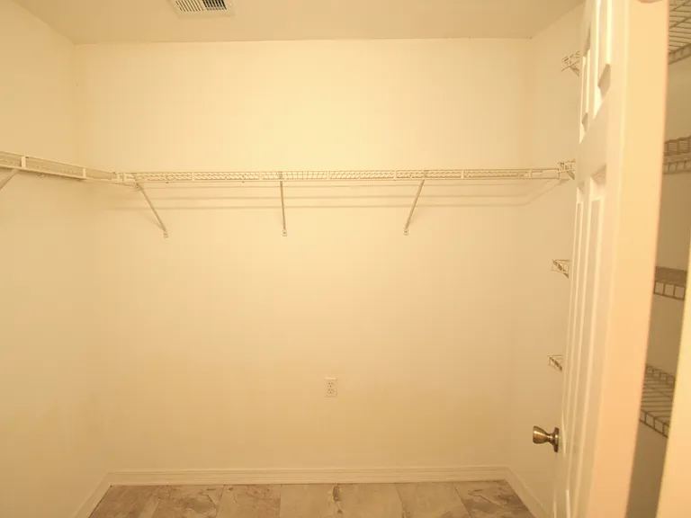 Master bed room walk in closet