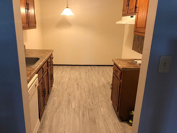 Eat-in kitchen with GE Appliances Wide Plank Flooring