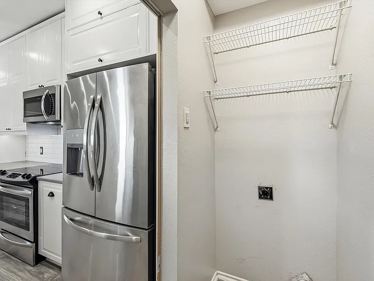 Refrigerator will stay for tenant use. Full washer and dryer area.