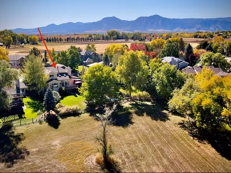 Surrounded by trees, flower and vegetable gardens, backs to 15 acres of private land