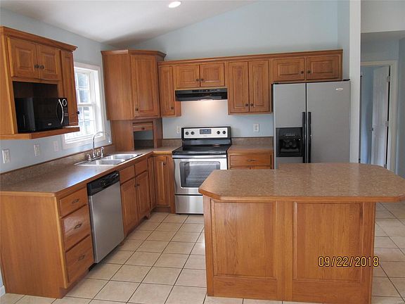 Awesome kitchen with island breakfast bar.