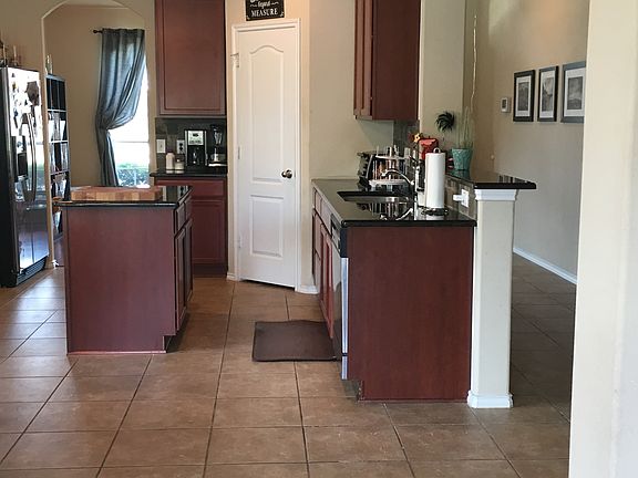 Kitchen that looks out onto living room