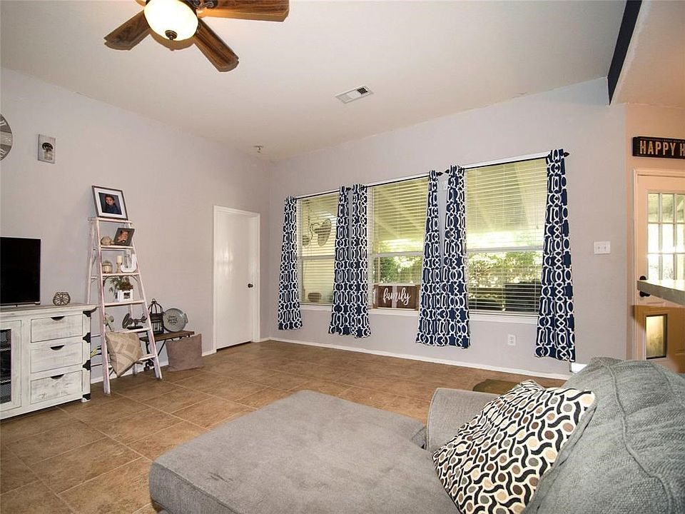 High ceilings and bright view out to your covered patio and large back yard at 12366 Green Ridge Dr.