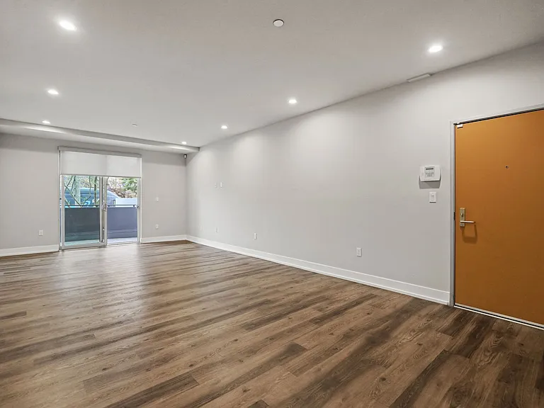 Living Room with Recessed Lighting, Vinyl Flooring, and Patio