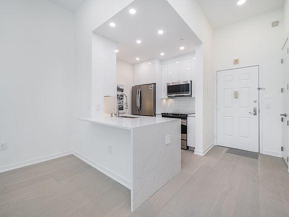 Quartz countertops Kitchen with space for bar stools