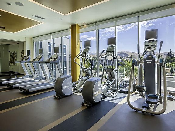 FiT: Tech-Driven Fitness Center with Personal TVs on Cardio Machines