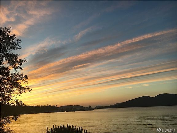 Glorious sunsets await along with Ferry traffic to the San Juan Islands.   This view is to the West, Northwest.
