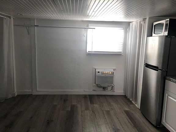 Looking at rear half of the apartments kitchen-including the 30 gallon hot water heater-just past the fridge and the 12,000 btu in-wall A/C.