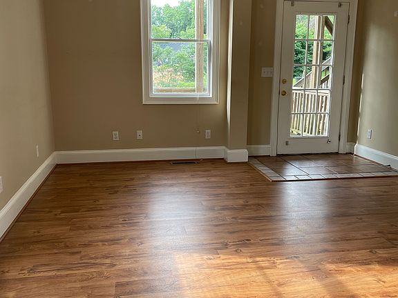 Living room. Picture taken from the kitchen.

All walls were painted in July 2024 and new slat blinds are on all the double hung windows.