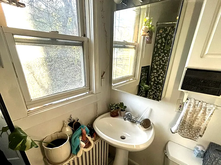 Clean, bright bathroom with window for natural light