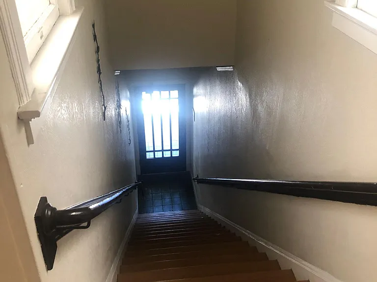 Stairs of apartment building leading to front door