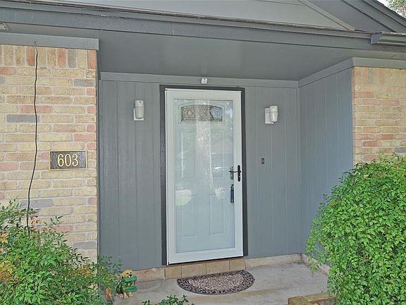 Fresh entry with full glass storm door.