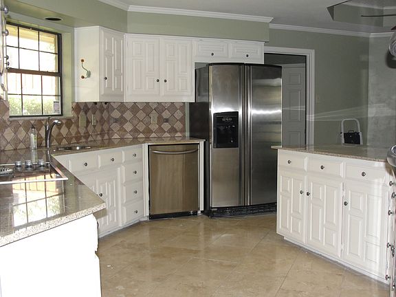 kitchen w/granite, travertin