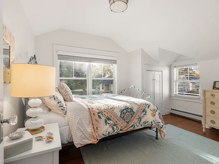 Queen guest room with room for a desk, chair.