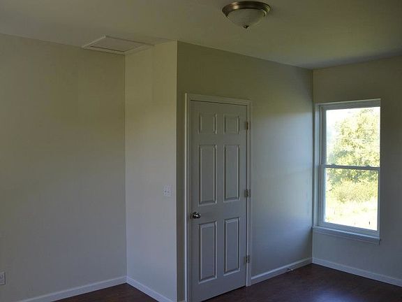 upstairs back bedroom w/stairwell to kitchen