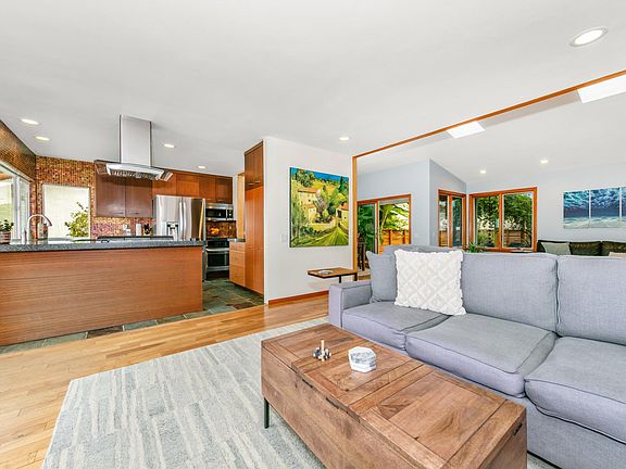 Living area facing kitchen with french doors to wide open ocean views