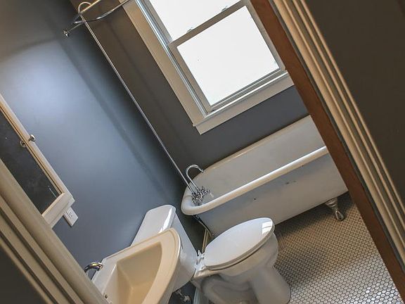 Second floor full bath featuring refinished original clawfoot tub