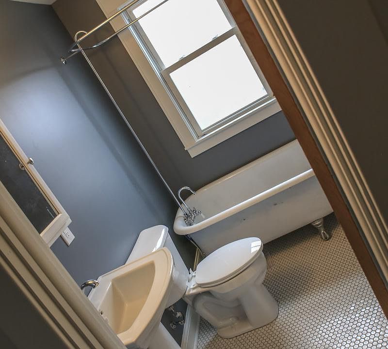 Second floor full bath featuring refinished original clawfoot tub