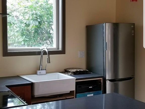 Quartz countertops. Glass pendum lighting. 