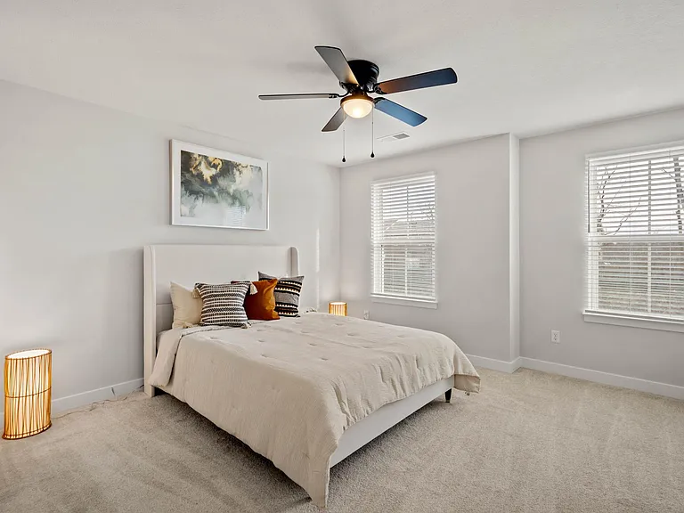 Second bedroom with queen bed and double dresser