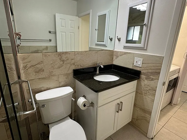 BATHROOM,
VIEW FROM SHOWER AREA.