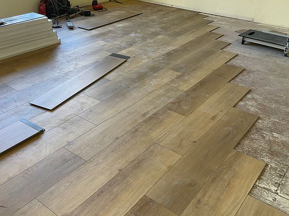 Butterscotch vinyl plank floor throughout