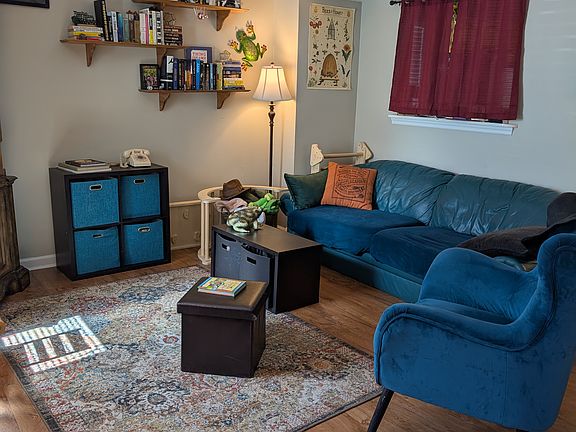 Living room with cut out pass through to kitchen (current tenant has curtain over it)