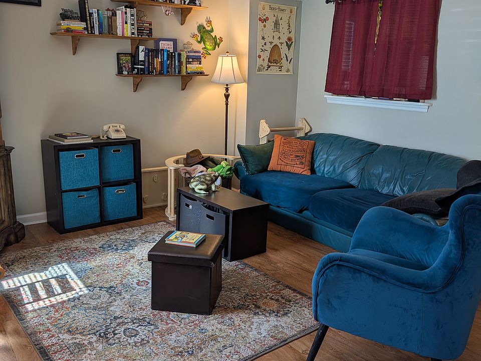 Living room with cut out pass through to kitchen (current tenant has curtain over it)