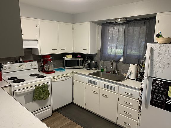 Kitchen. Note that the stove has been replaced with a new stainless glass top range,