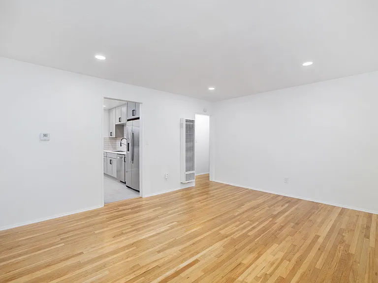 Generously sized living room with dimmable lights for customizable ambiance control.