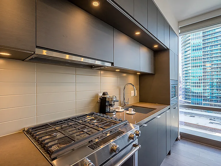 Quartz Countertops and Premium, Ceiling-Height Cabinetry