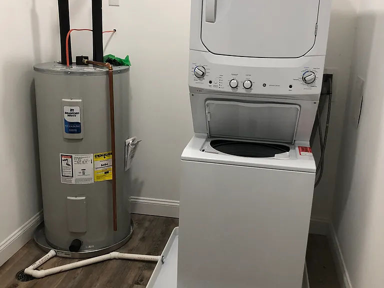 Laundry Room Full size energy efficient stackable washer and dryer