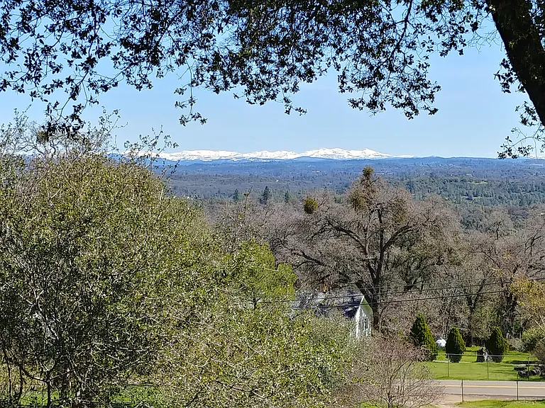 This is the more natural view of the Sierra range. So pretty when it snows. That is the main road below positioned north to Green Valley Road to the left, and south to highway #50 on the right.