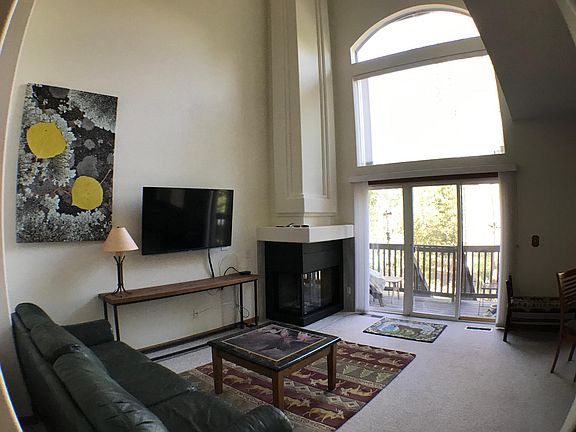 LIVING ROOM DECK AND FIREPLACE